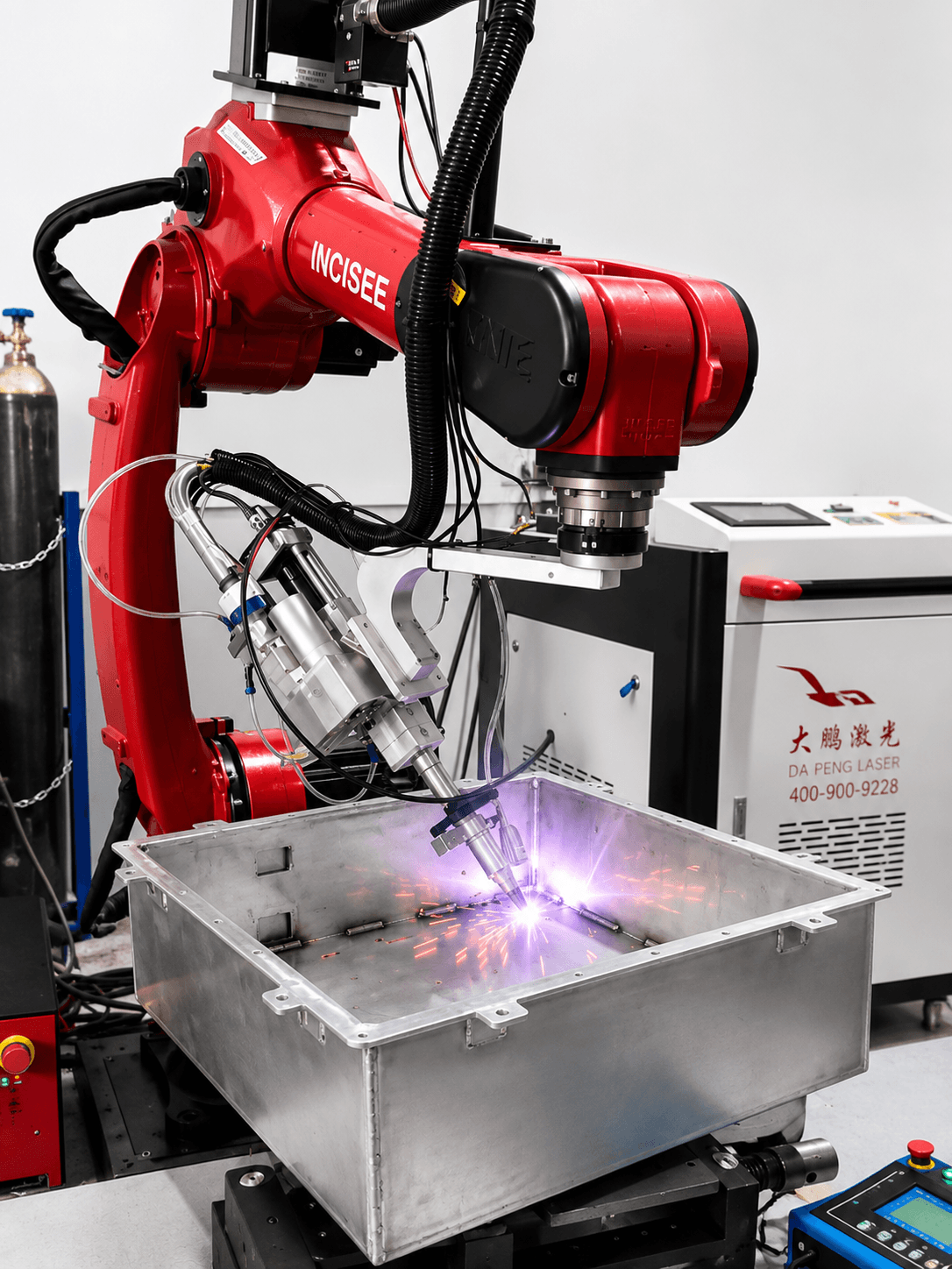 Robotic laser welding cell welding a sheet-metal enclosure at the Incisee facility